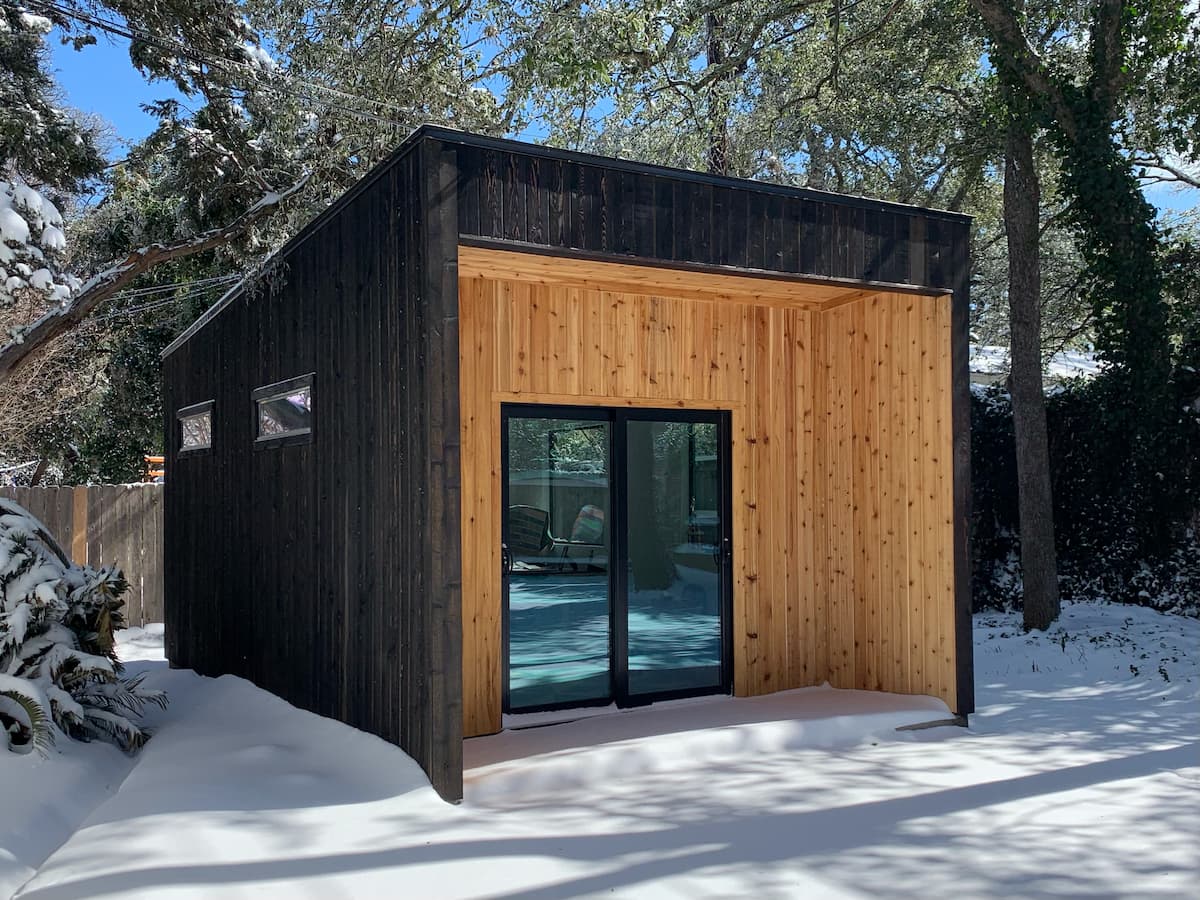 Backyard office shed exterior in snow
